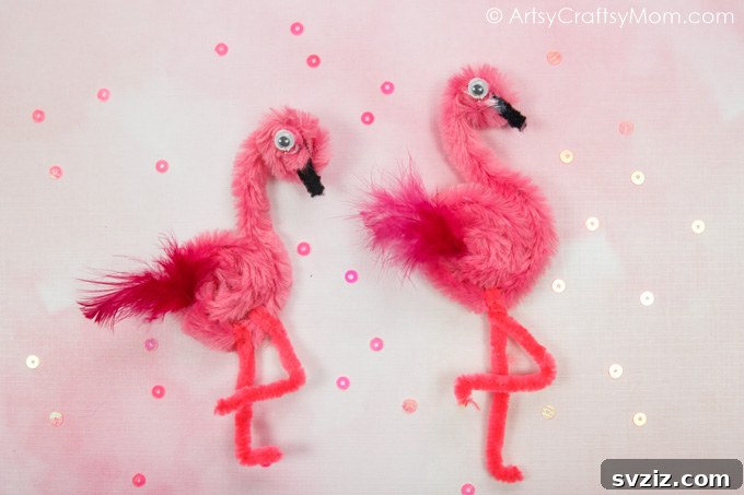 27 Creative Pipe Cleaner Crafts 17 Elegant pipe cleaner flamingo craft with a pink feather, standing on one leg.