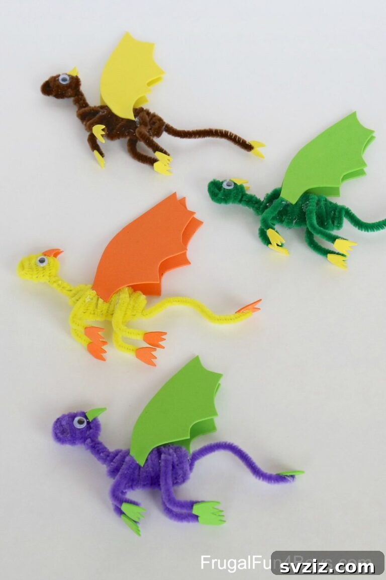 27 Creative Pipe Cleaner Crafts 20 Fantasy pipe cleaner dragons in various colors with craft foam wings, standing on a surface.