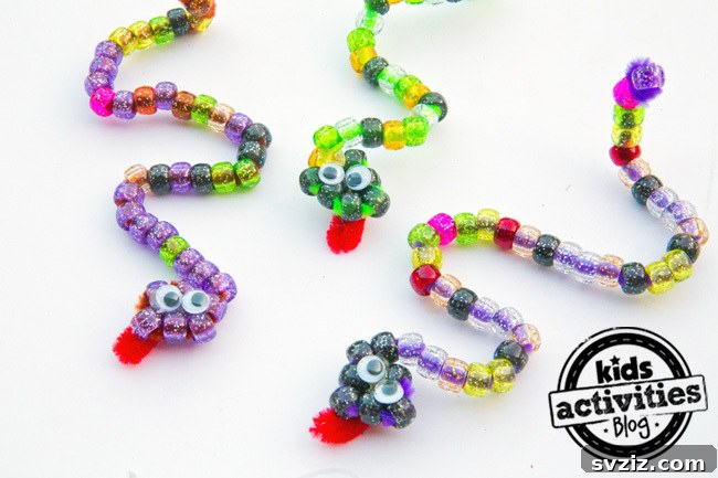 27 Creative Pipe Cleaner Crafts 4 Colorful beaded snakes made with pipe cleaners, great for toddler development and hand-eye coordination.