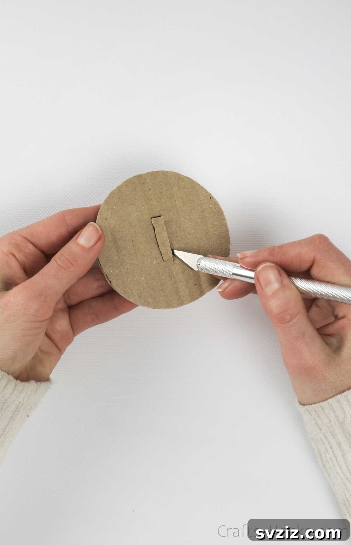 Repurposed Tin Treasures 17 Using a hobby knife to cut a rectangular slot into the cardboard lid for coins