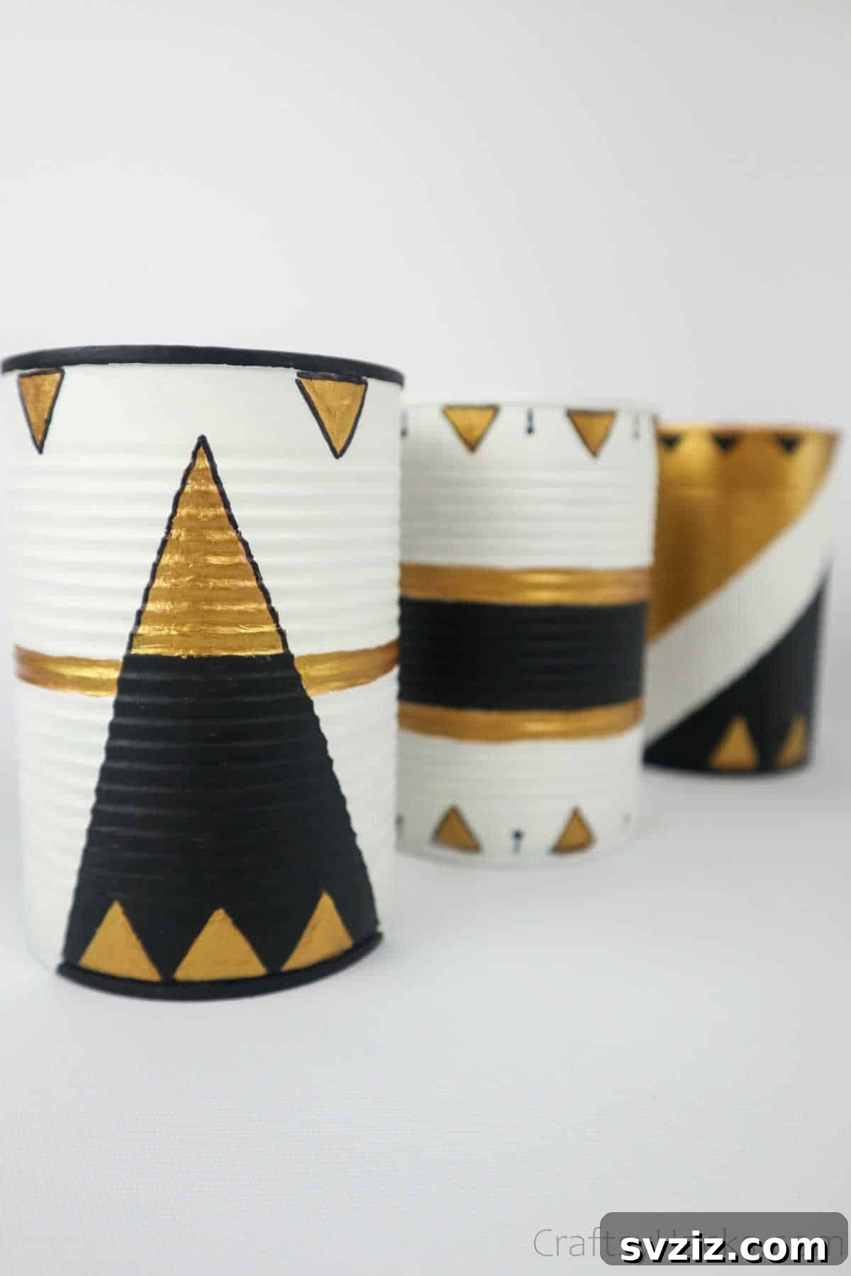 Repurposed Tin Treasures 24 Close-up of elegantly decorated upcycled tin cans with geometric patterns