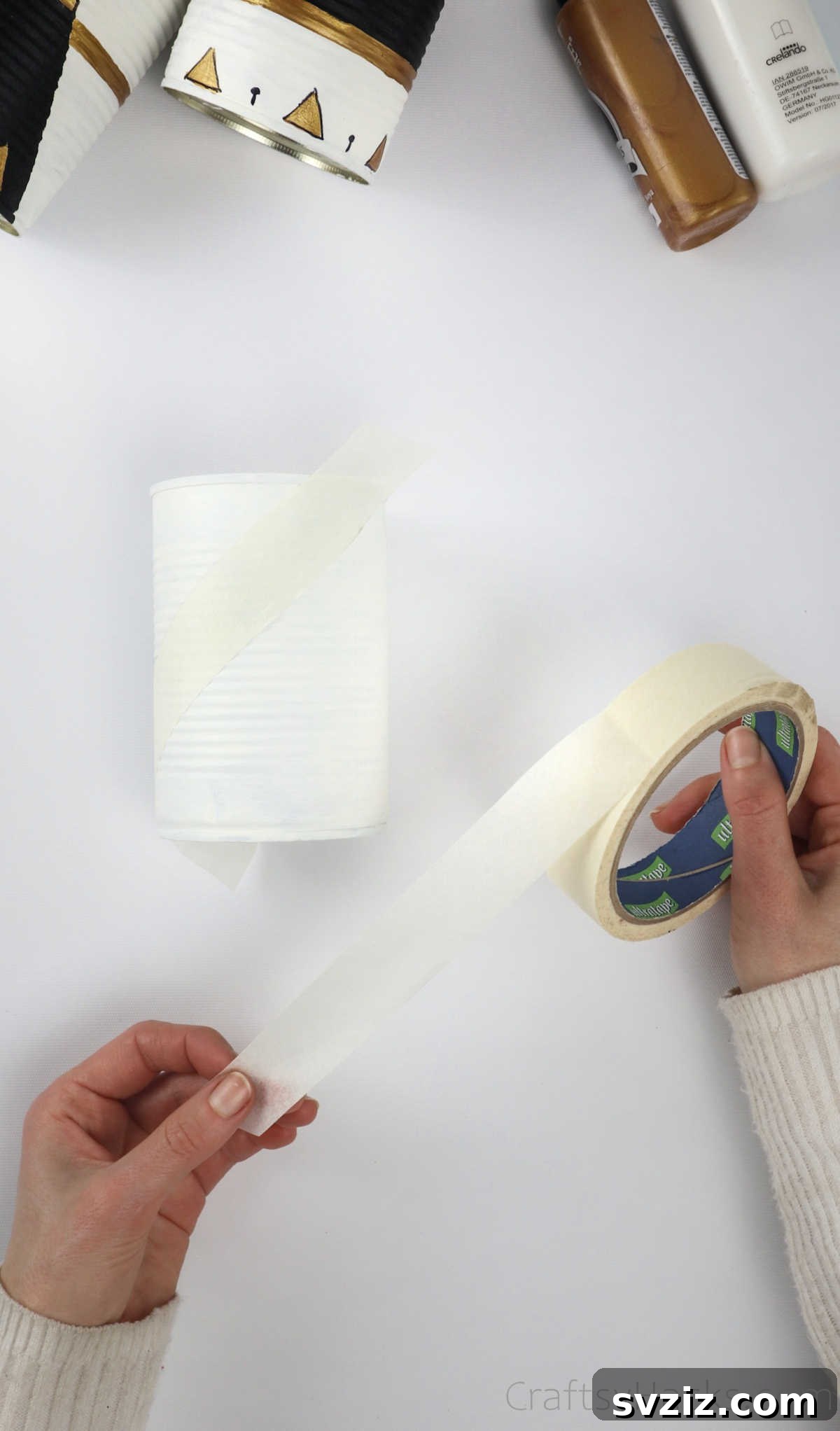 Repurposed Tin Treasures 8 Applying masking tape to a white-painted tin can to create geometric patterns
