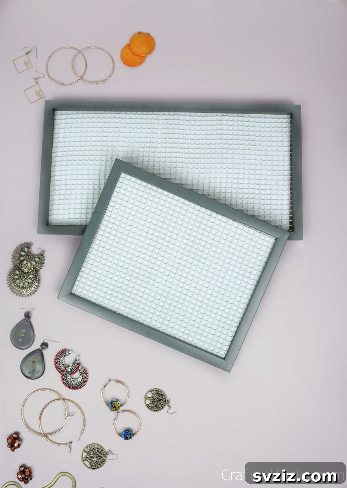 Turn Old Frames into a Chic Earring Organizer 15 Several DIY earring organizers displayed together, adorned with earrings, demonstrating their aesthetic appeal