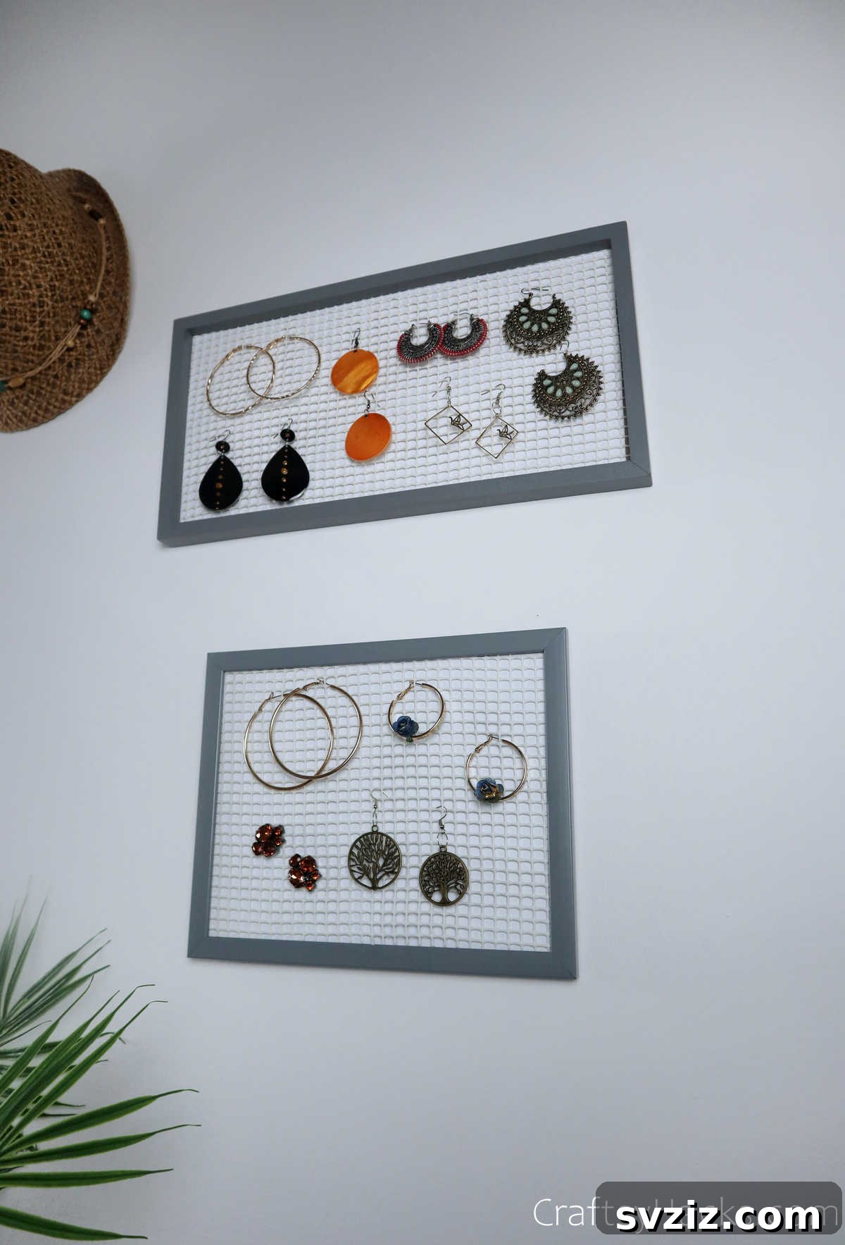 Turn Old Frames into a Chic Earring Organizer 19 DIY earring organizers elegantly displayed on a wall, showcasing their decorative and functional qualities