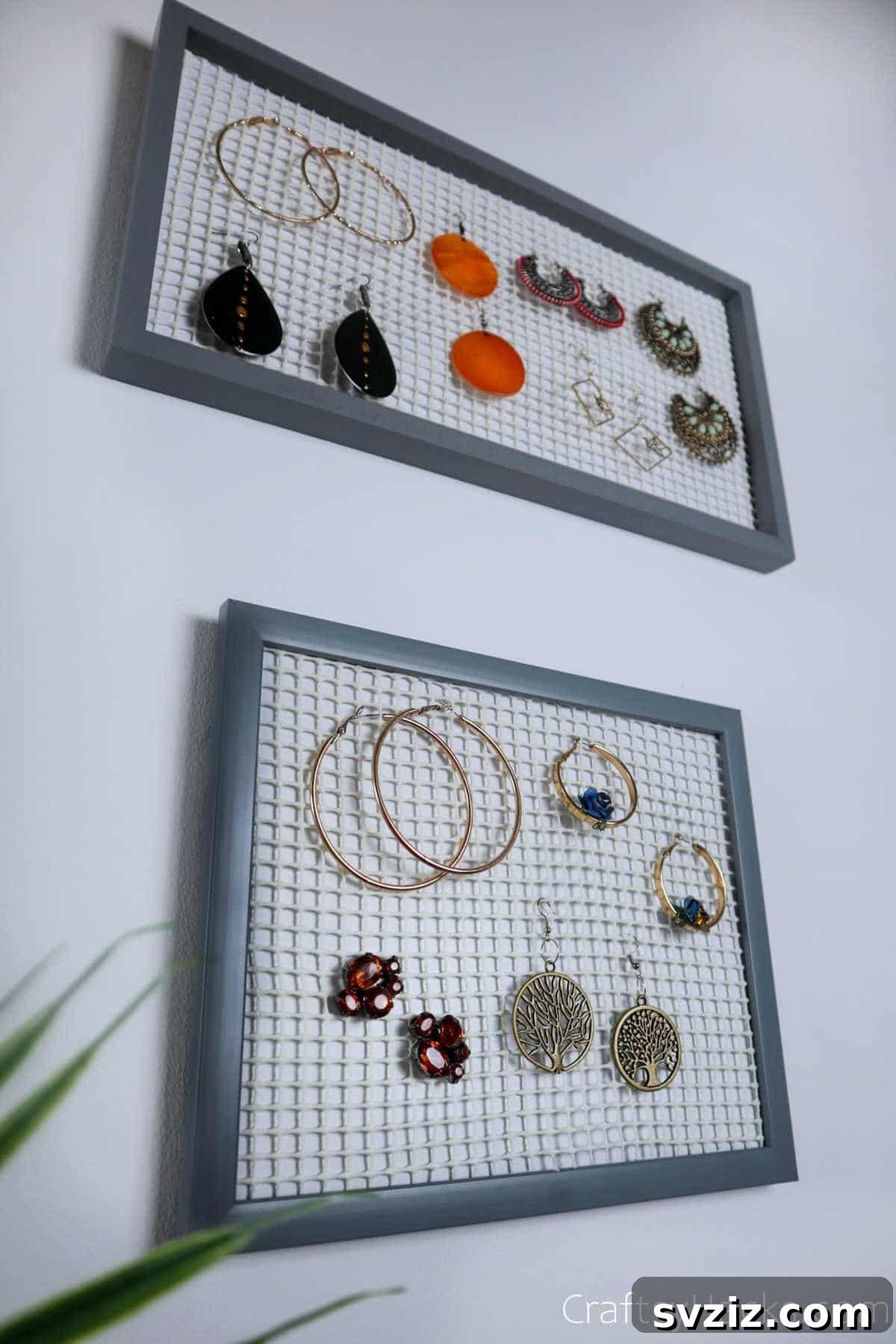 Turn Old Frames into a Chic Earring Organizer 4 Close-up of three DIY earring organizers made from picture frames, showcasing various earrings