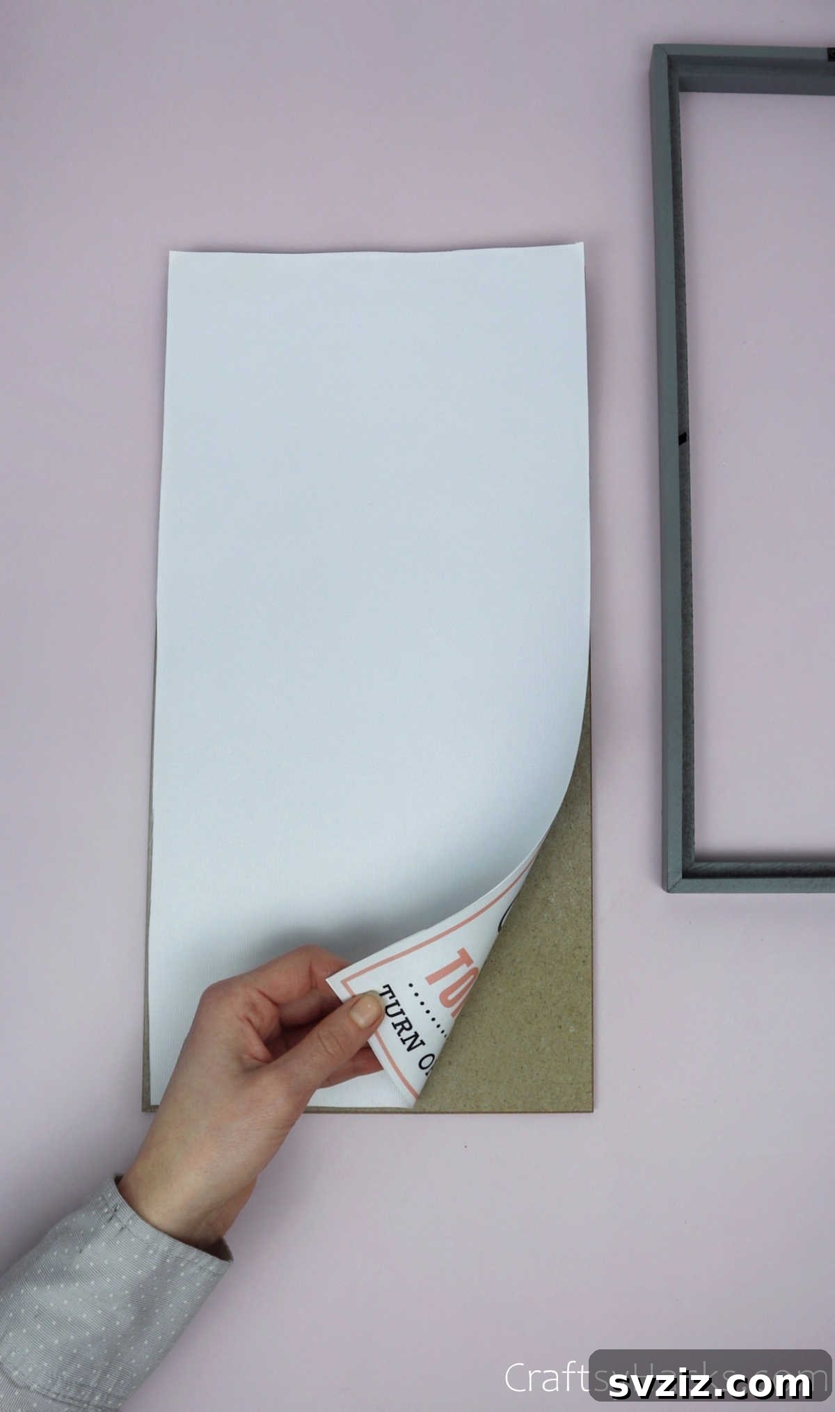 Turn Old Frames into a Chic Earring Organizer 7 Removing a generic picture from a photo frame to prepare it for customization