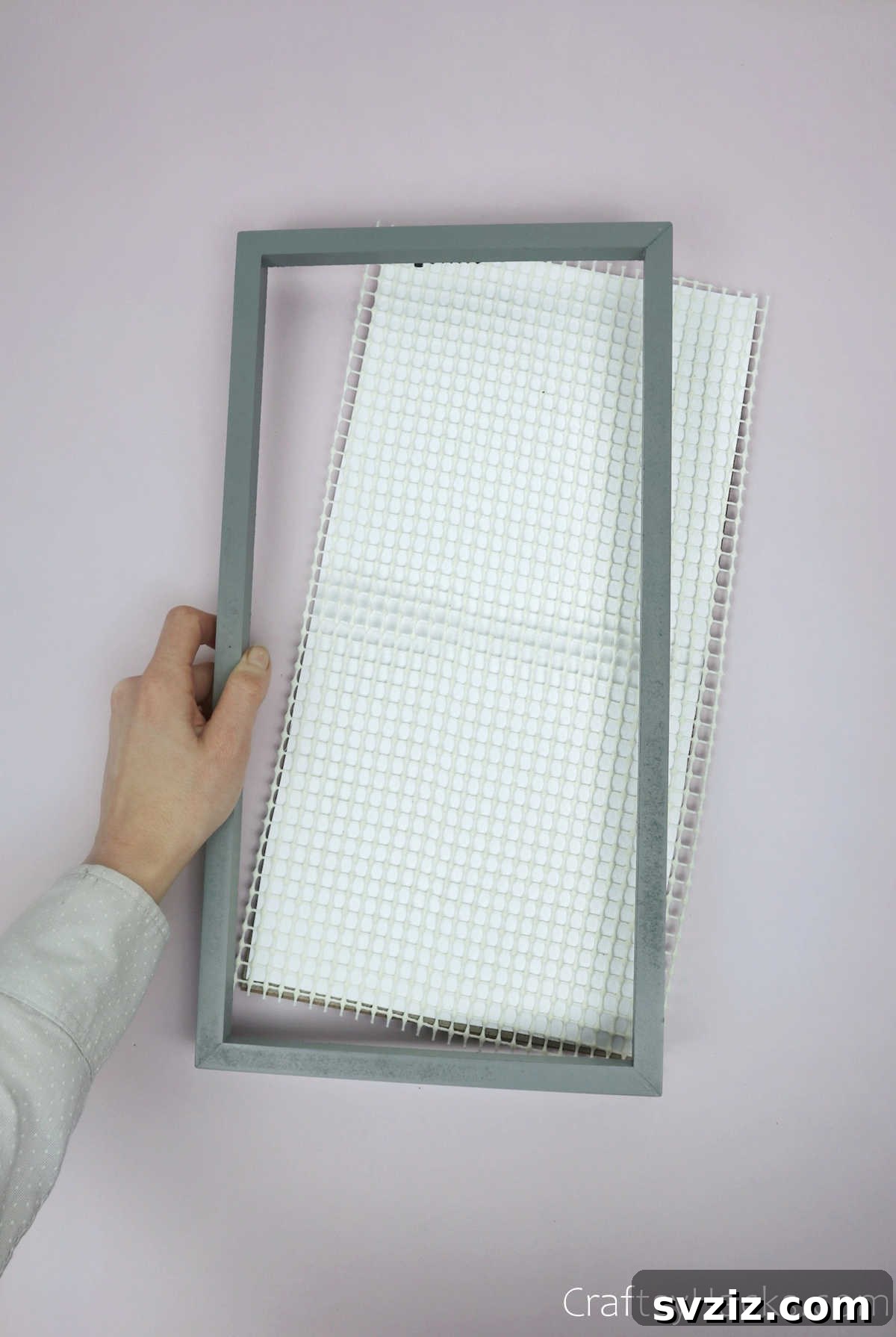 Turn Old Frames into a Chic Earring Organizer 9 Reassembling the photo frame, ensuring the liner is taut and secure