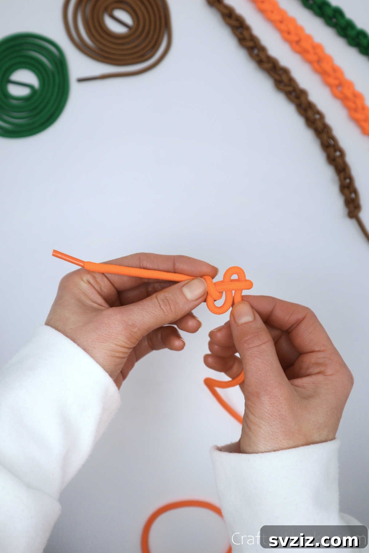 creating second knot with shoelace