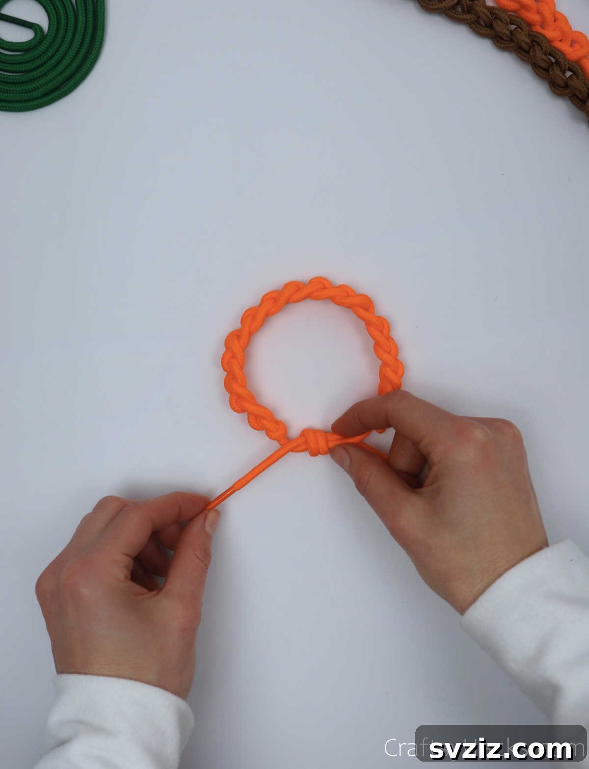 holding end of shoelace bracelet