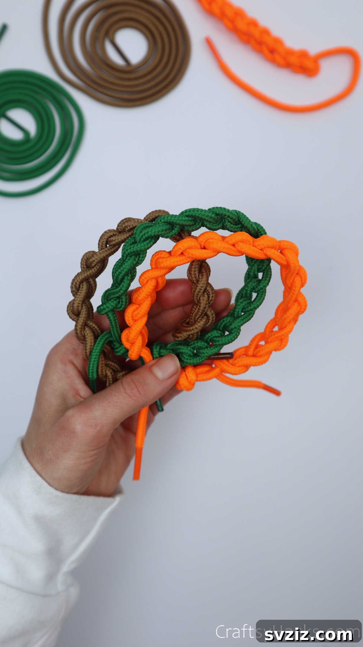 brown, green and orange shoelace bracelets