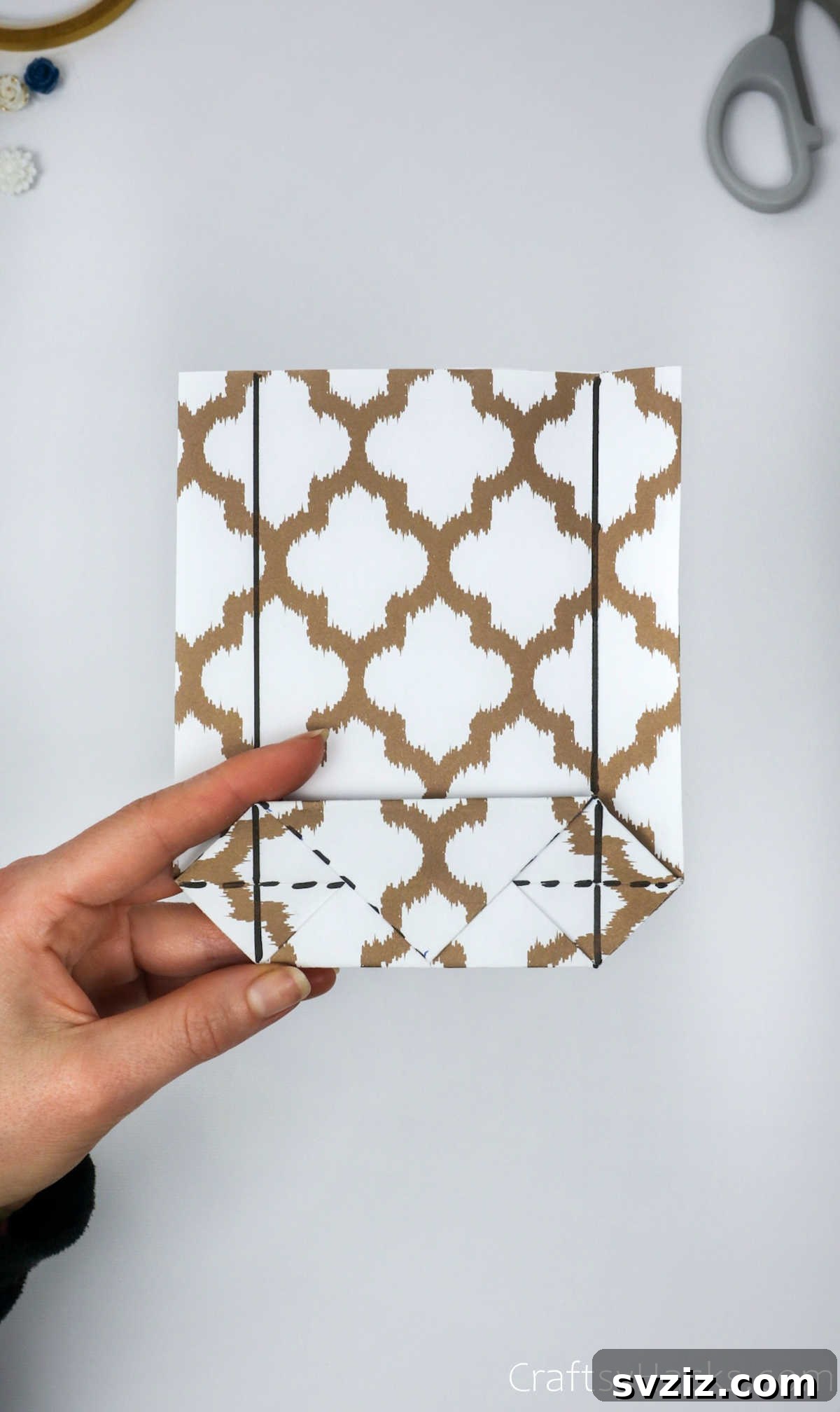 Homemade Touch: Custom Gift Bags 20 Paper showing vertical lines drawn on the sides to guide the next set of folds.