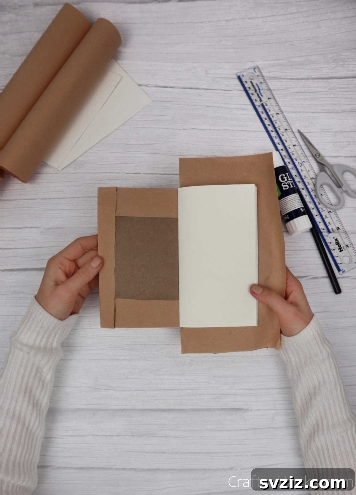 Make Your Journal Cover Unique 15 The folded and glued edge of the kraft paper neatly secured inside the journal cover, showing a clean finish.