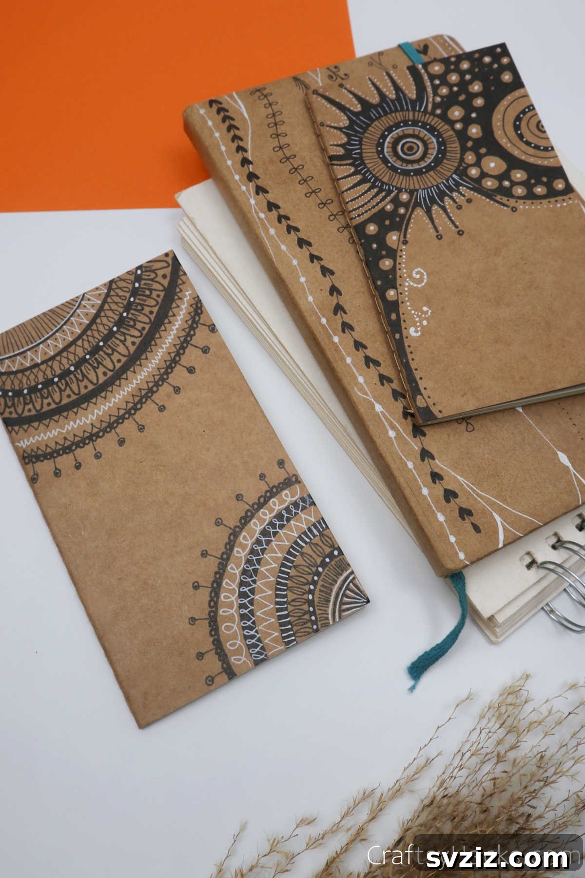 Make Your Journal Cover Unique 3 A stack of several colorful and uniquely decorated DIY journal covers, showcasing different artistic styles.