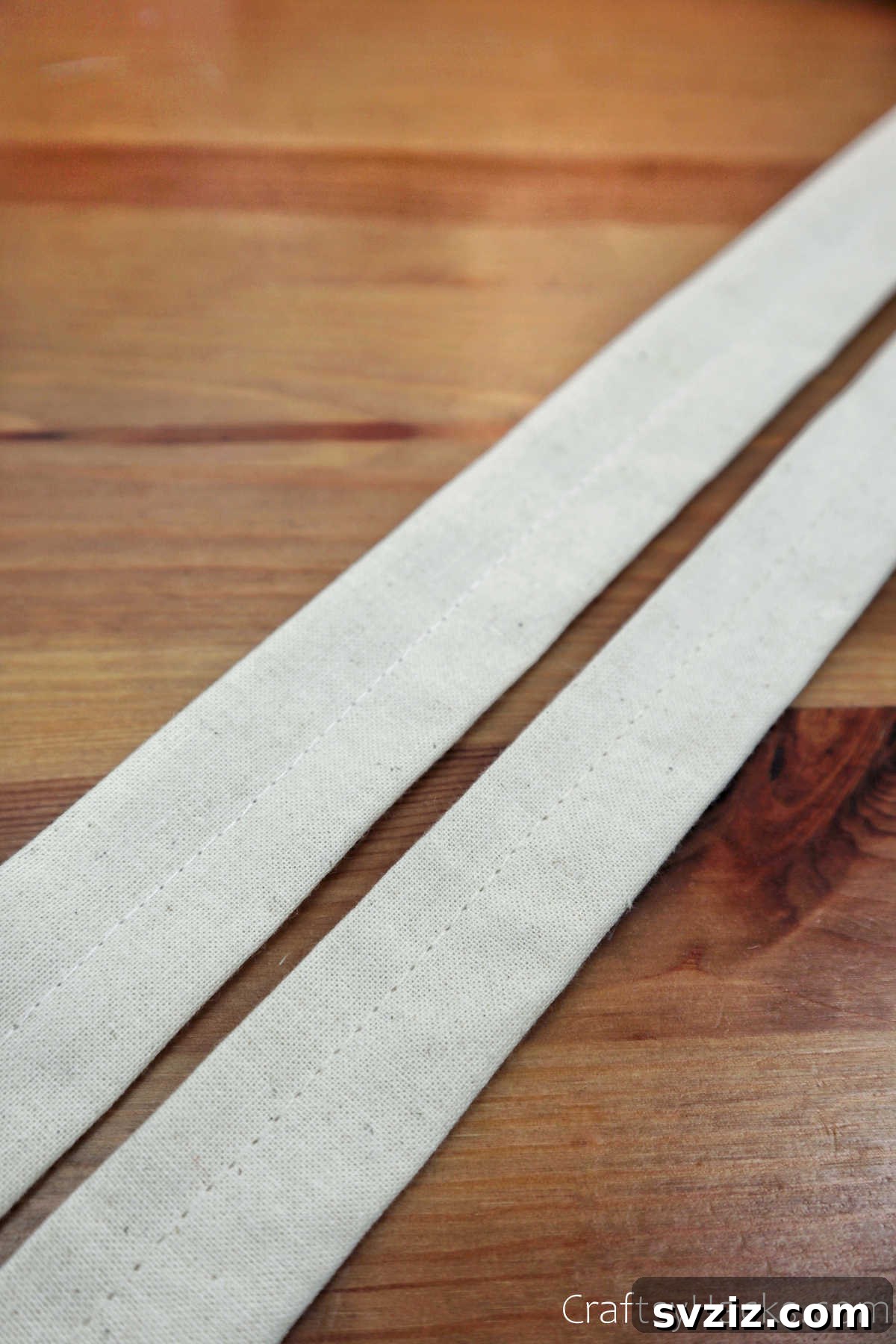 Strips of white fabric prepared for handles