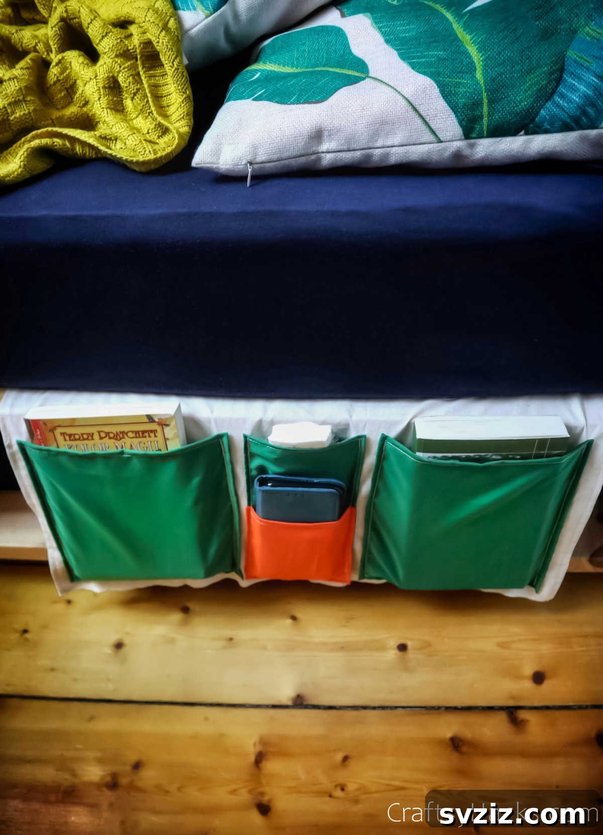 Bedside organizer featuring books and other essentials