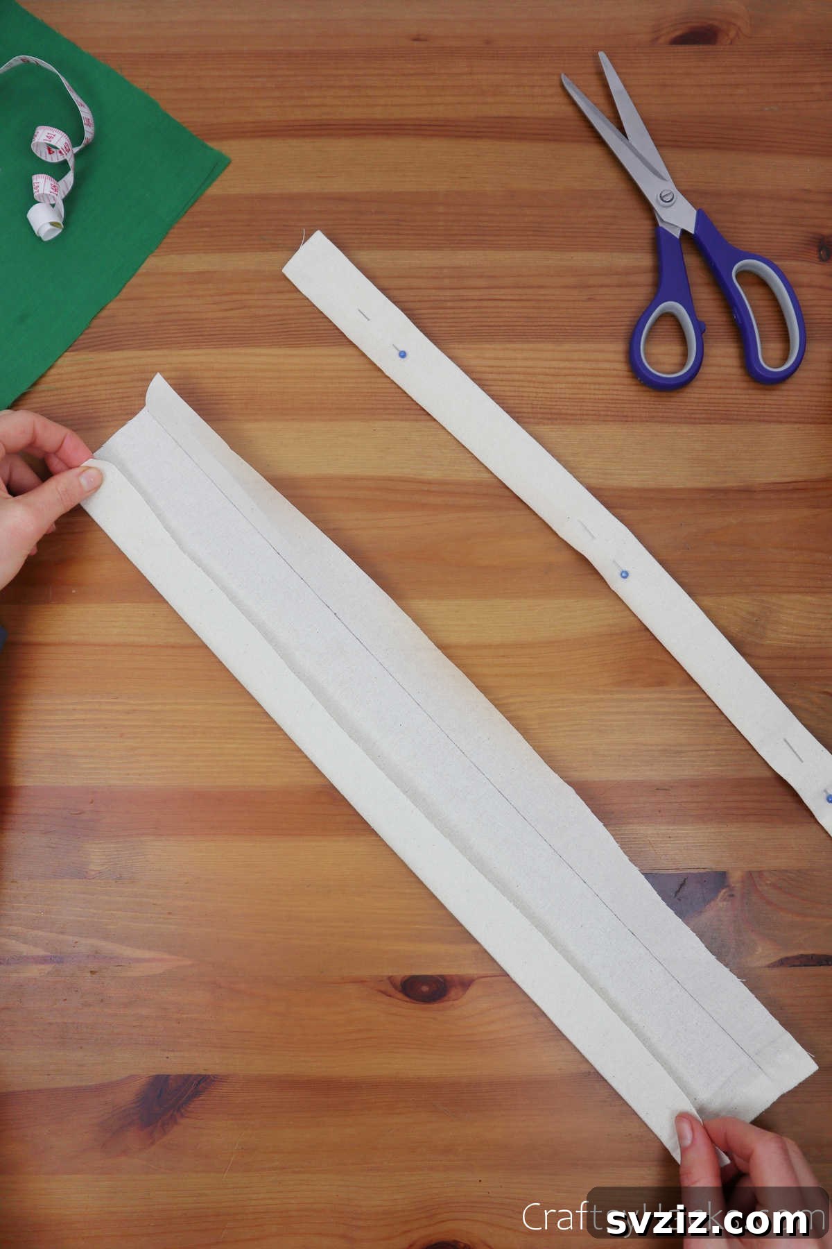 Folding a strip of fabric neatly