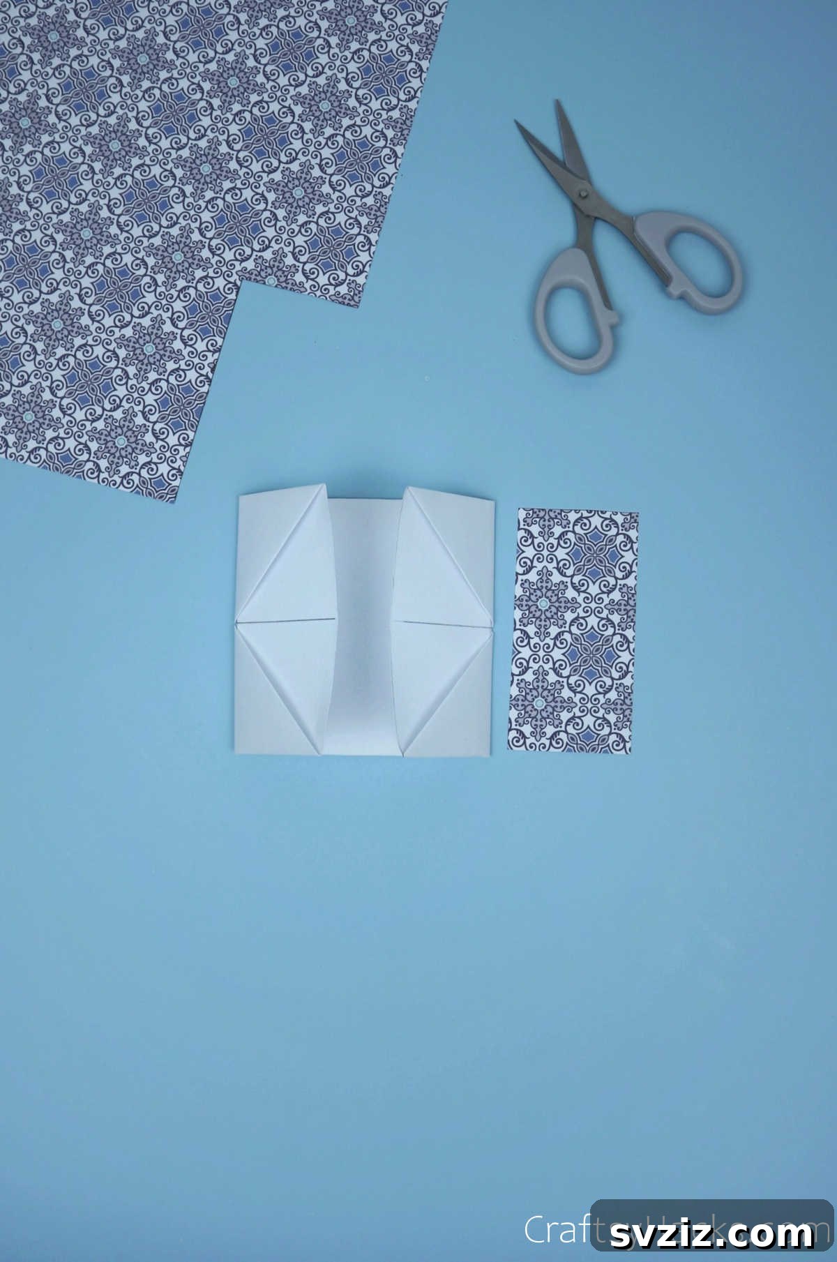 The module with both its top and bottom edges folded inwards by one square width, meeting perfectly in the center, forming a compact and finished segment.