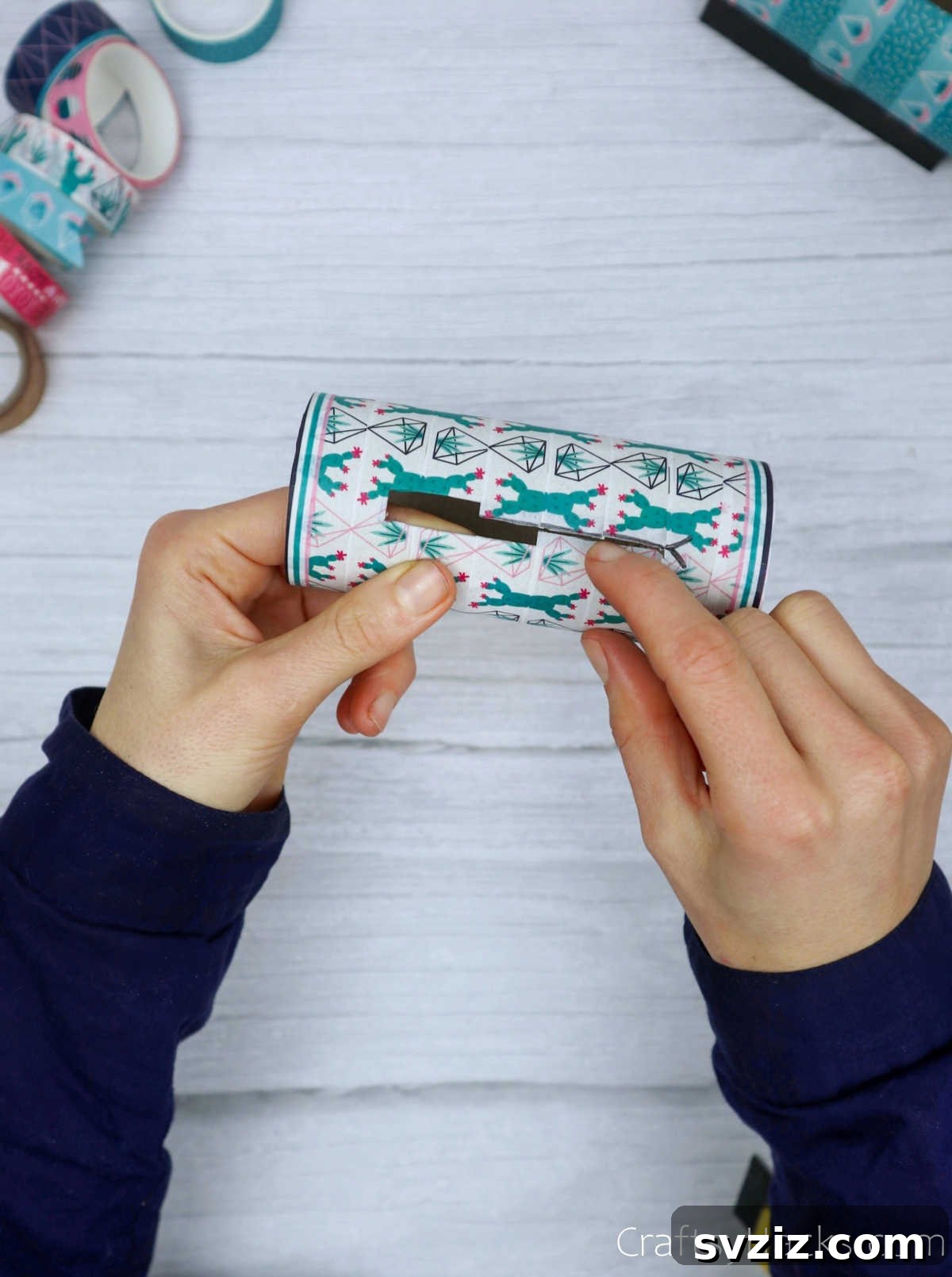 Roll Your Own Phone Stand from a Toilet Paper Tube 16 Washi tape edges neatly tucked into the phone slot, creating a smooth, finished opening.