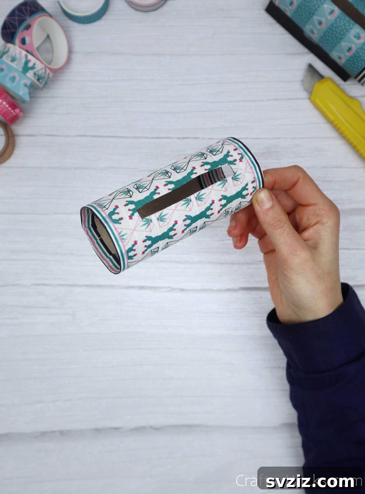 Roll Your Own Phone Stand from a Toilet Paper Tube 17 The completed and decorated paper roll base of the phone holder, with clean edges and a finished slot.
