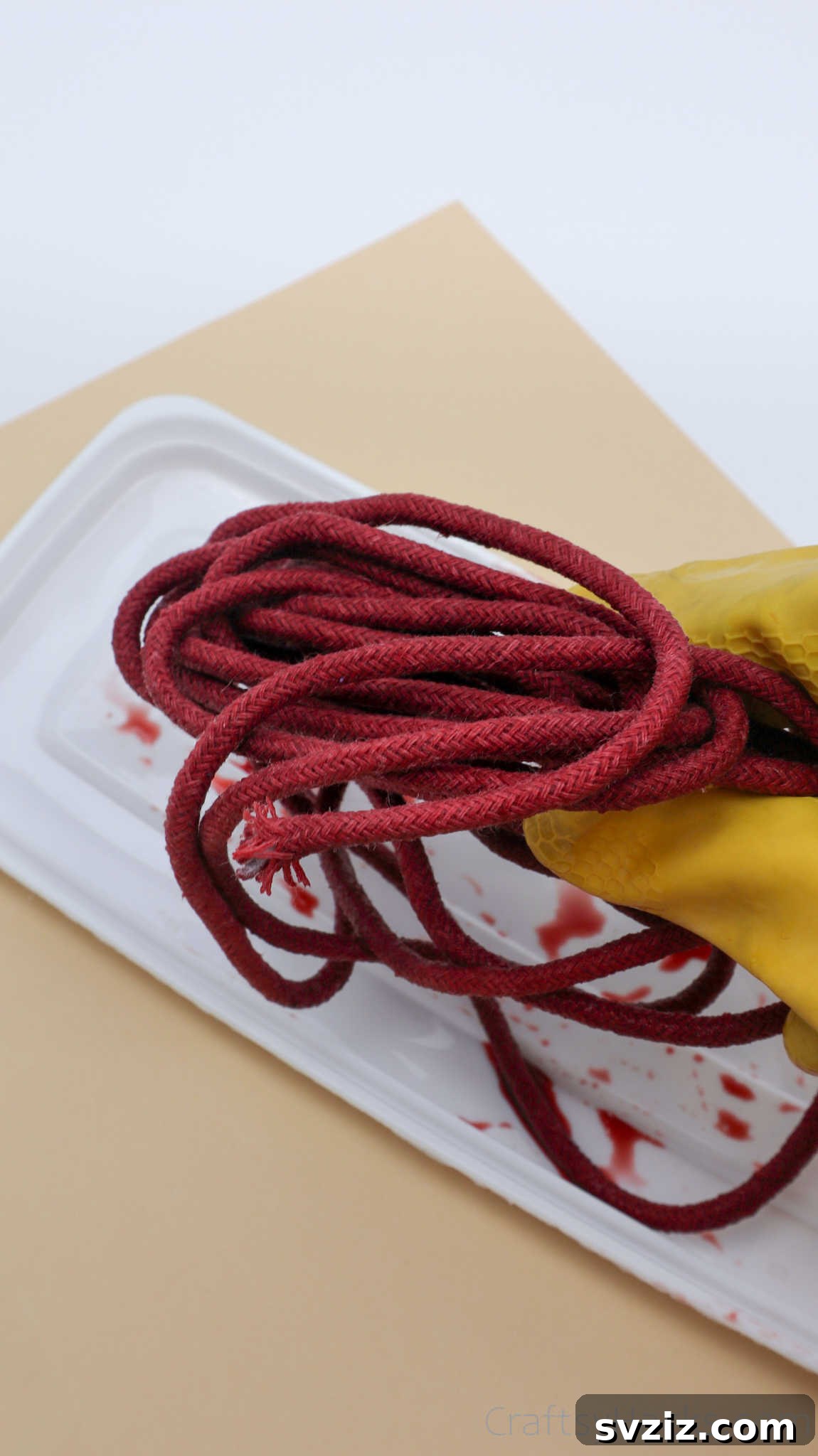 Stylish DIY Rope Basket 13 Carefully Holding Red-Dyed Rope Before Assembly
