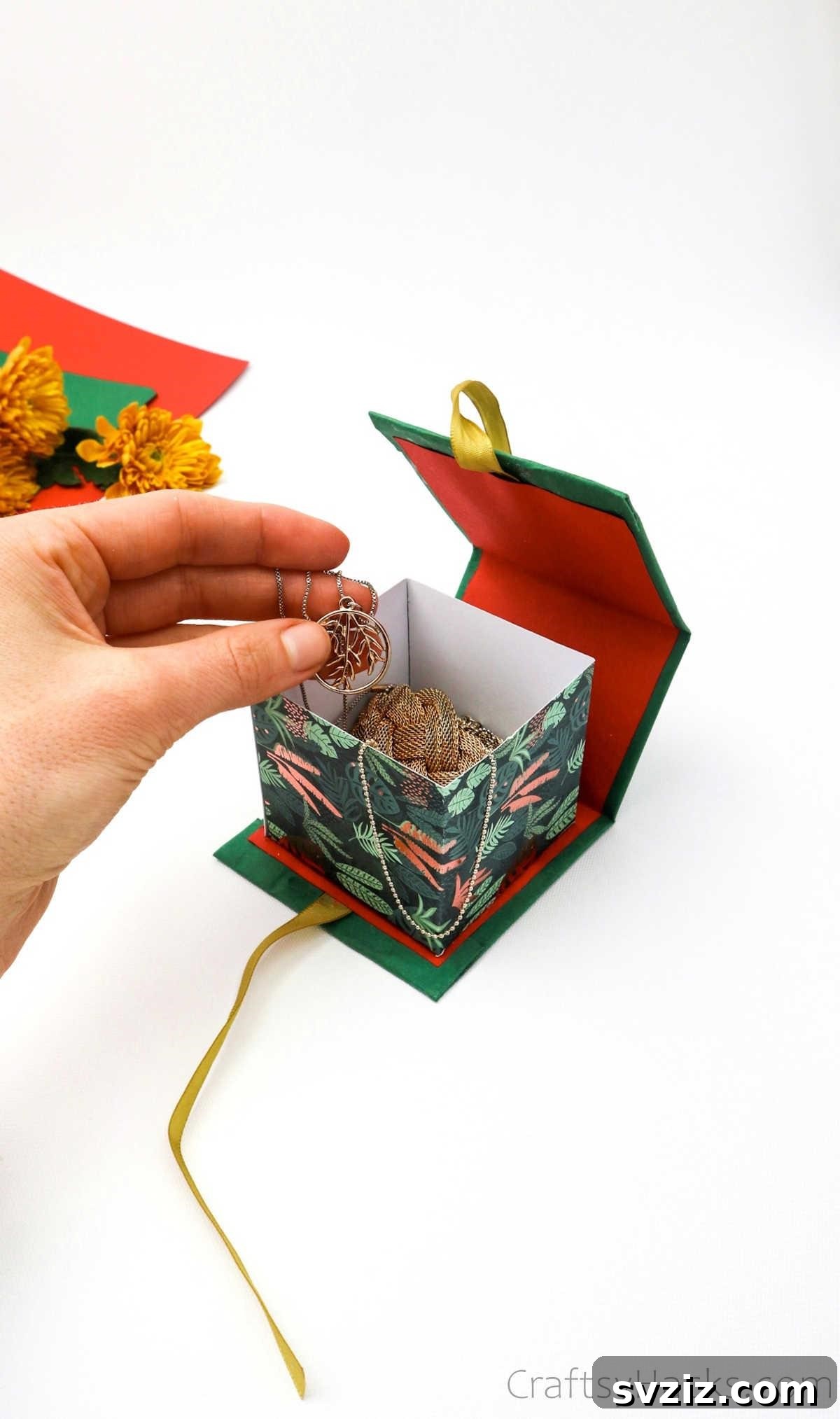 Craft Personalized Gift Boxes 3 holding necklace above gift box