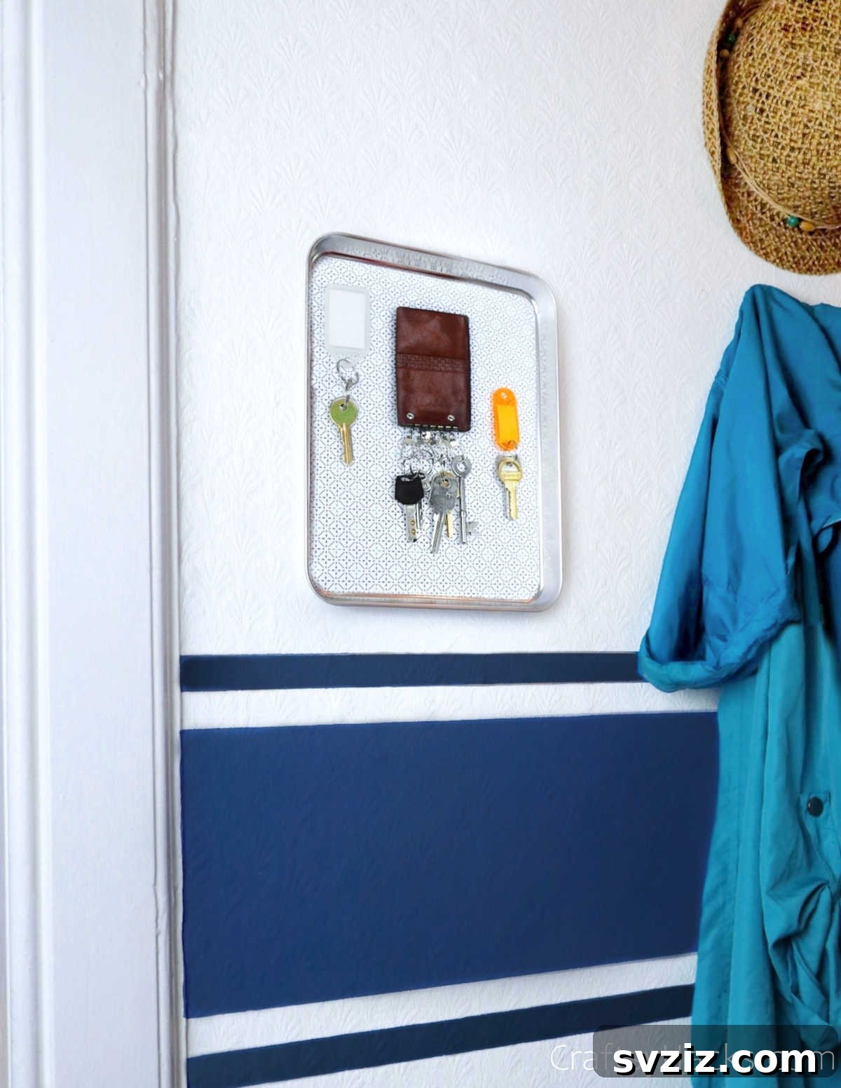 Magnetic tray mounted on a wall with keys and small items
