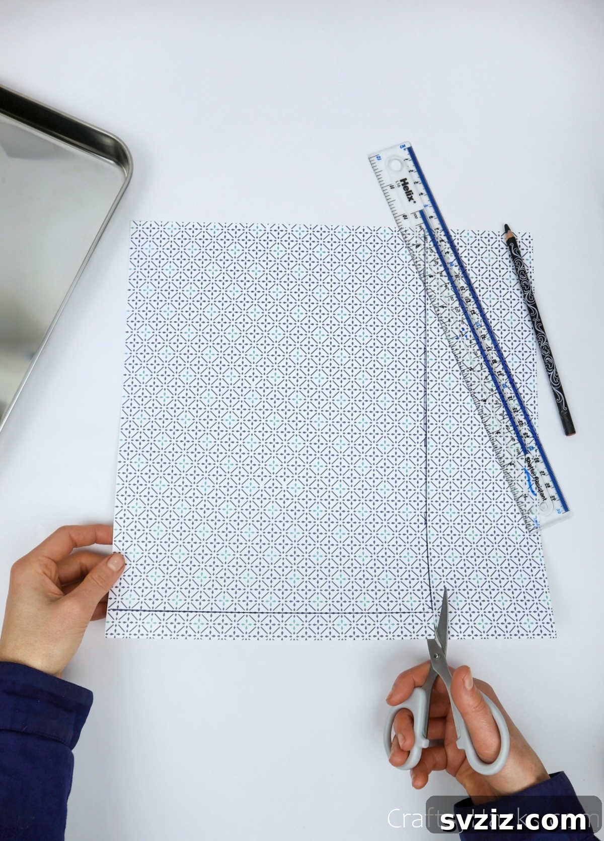 Cutting out patterned paper for a craft project