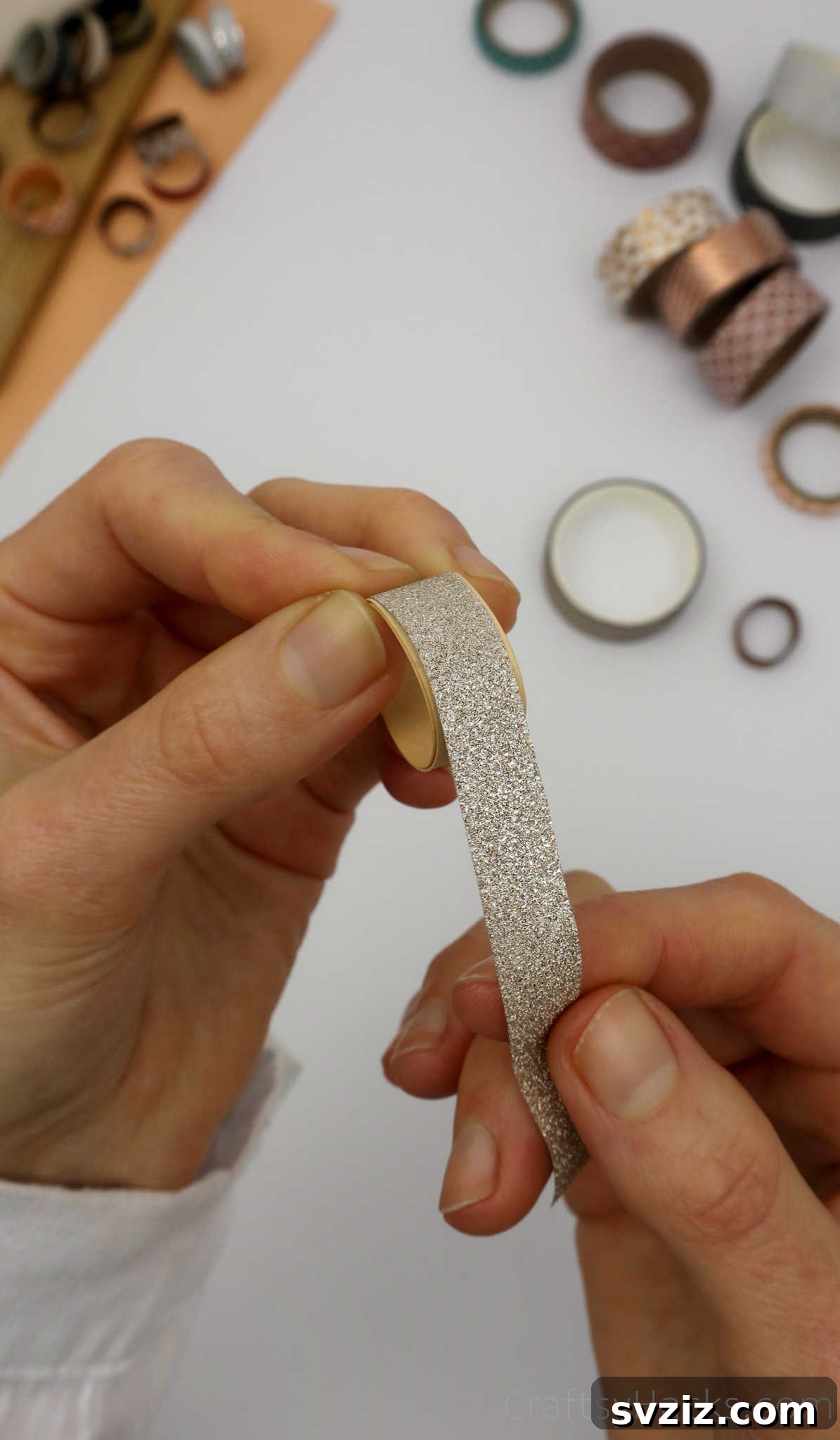 Craft Your Own Paper Ring 18 holding silver washi tape
