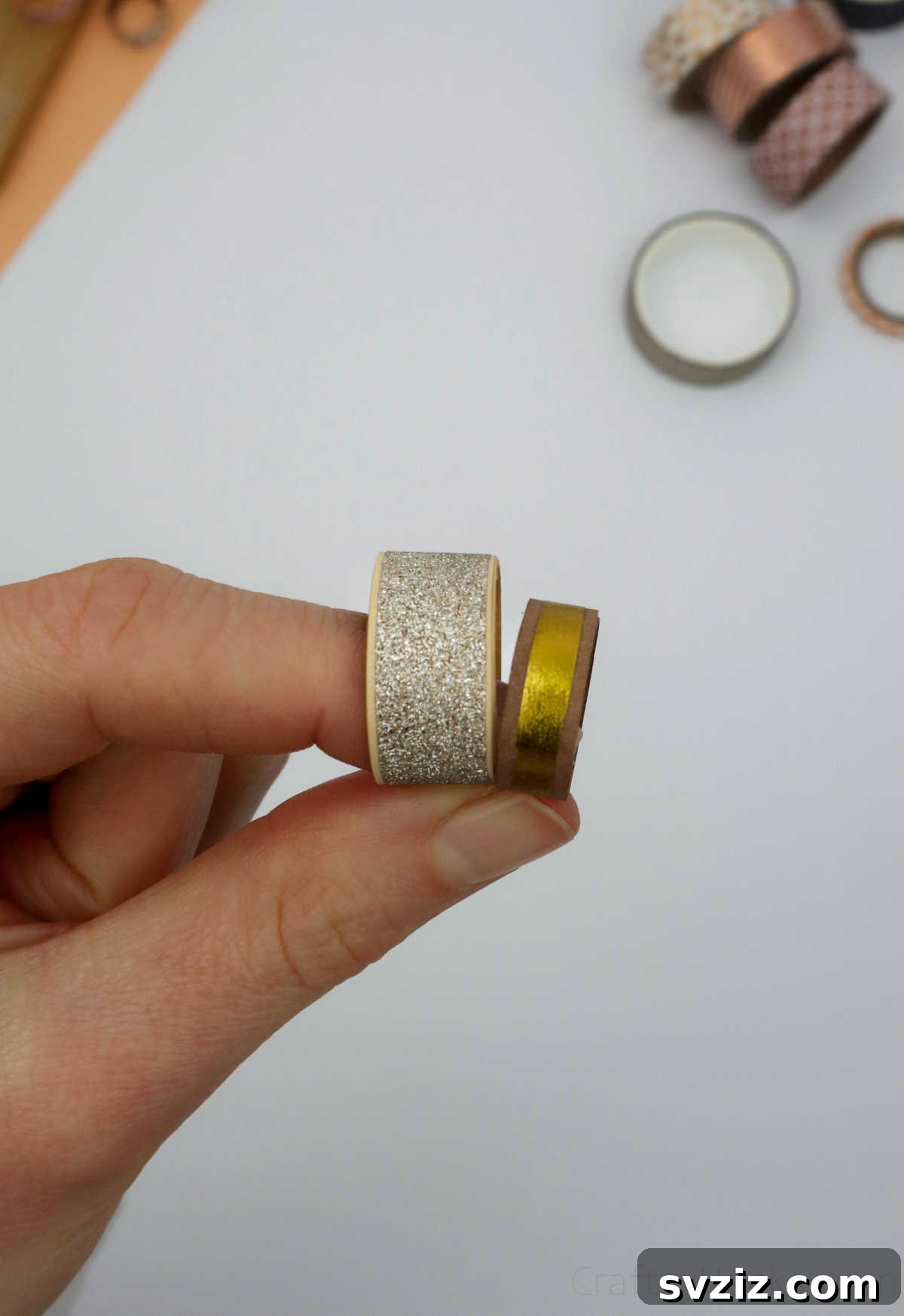 Craft Your Own Paper Ring 22 holding two paper DIY rings