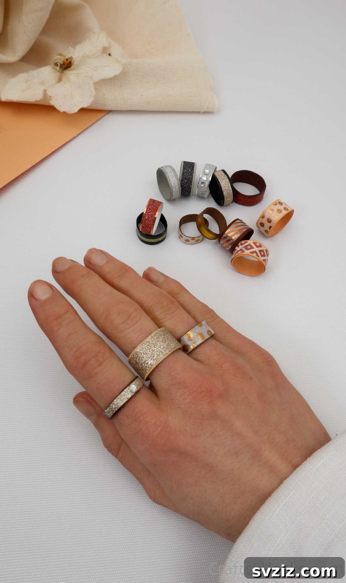 Craft Your Own Paper Ring 27 hand with 3 paper rings