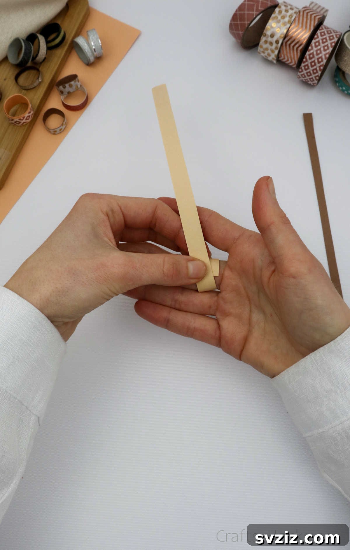 Craft Your Own Paper Ring 9 wrapping paper around finger