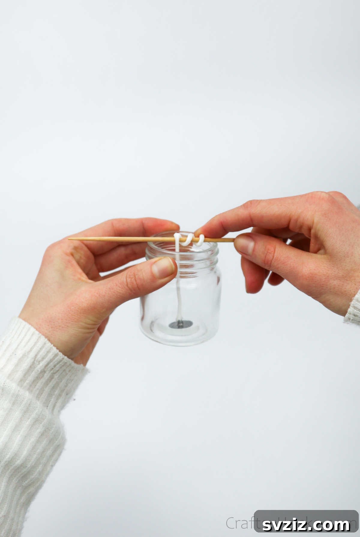 Crafting Your Signature Scented Candles 6 putting wick in jar