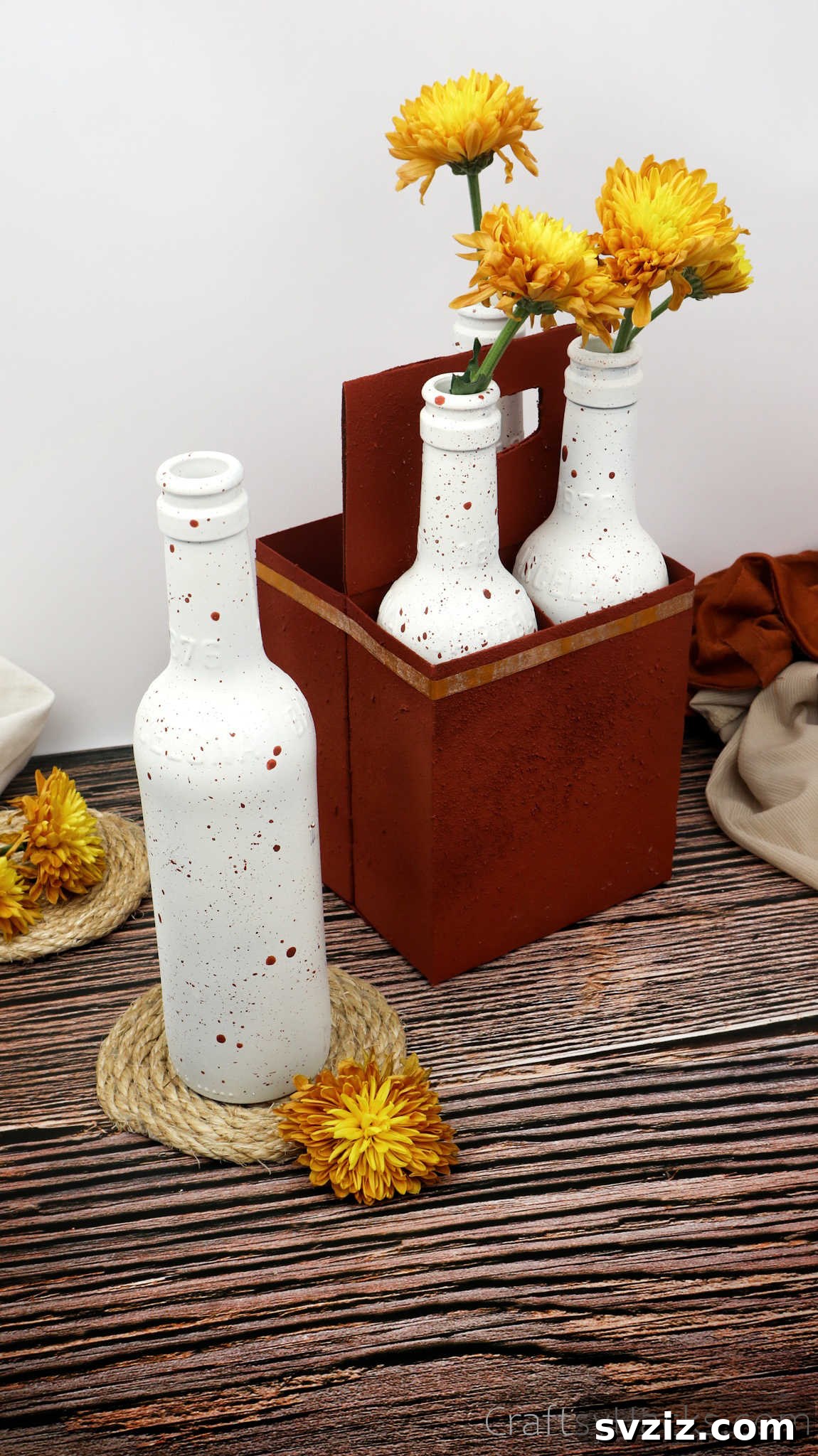 Upcycled beer bottle with flowers, perfect for wedding decor