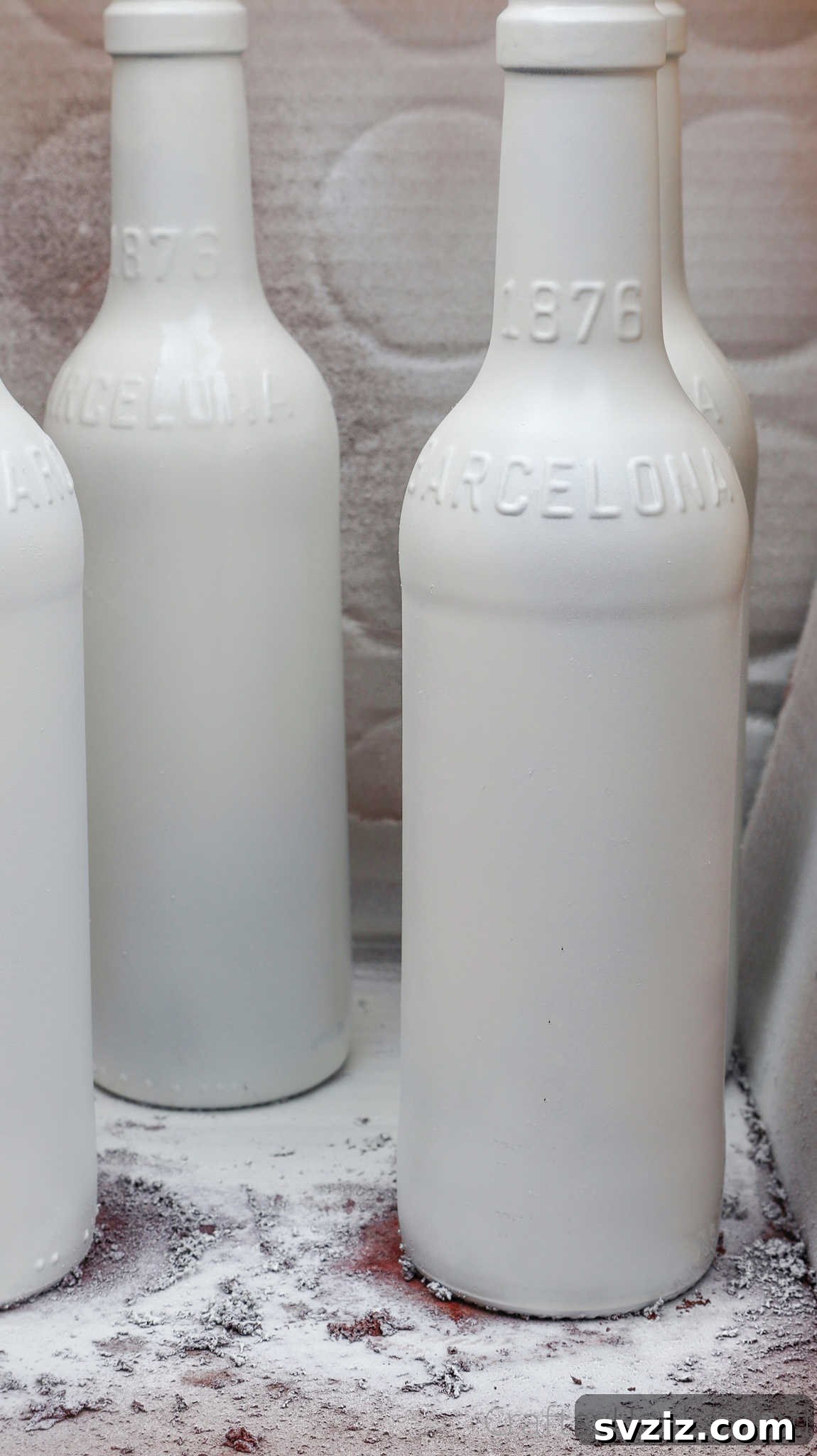 White painted beer bottles ready for decorating