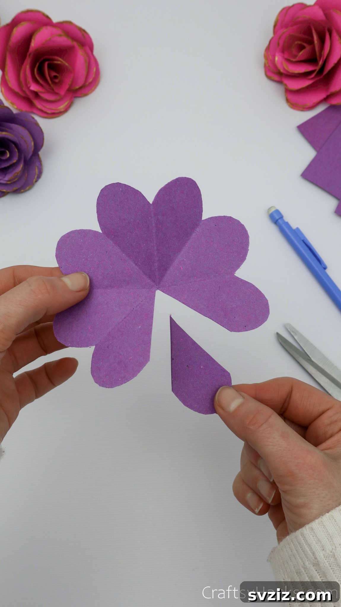 Crafting Beautiful Paper Blooms 13 A single petal being cut out from the unfolded paper flower shape to allow for overlapping