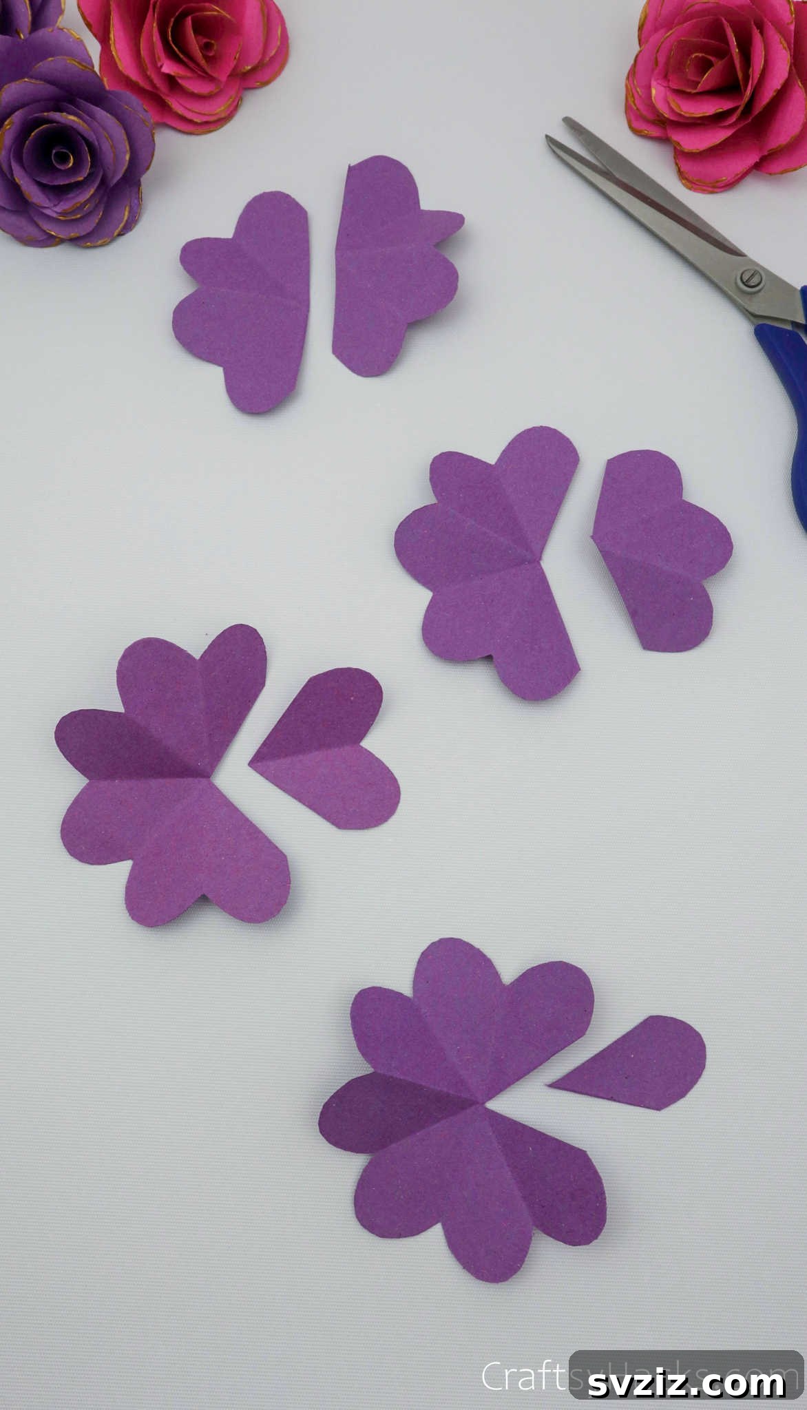 Crafting Beautiful Paper Blooms 15 A series of purple paper flower cutouts, each with a different number of petals removed, ready for assembly