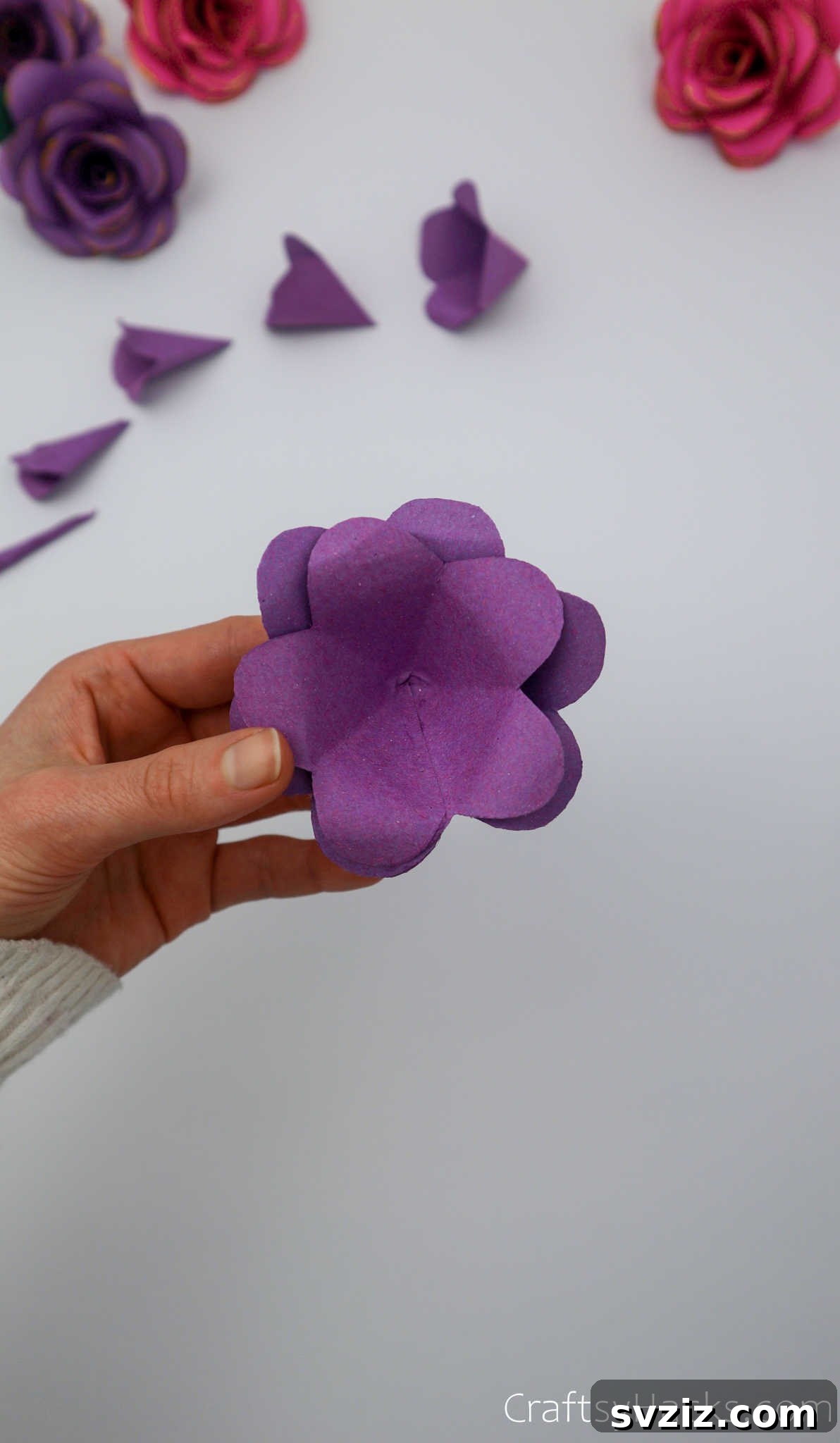 Crafting Beautiful Paper Blooms 25 A partially assembled purple paper flower, showing multiple layers neatly stacked