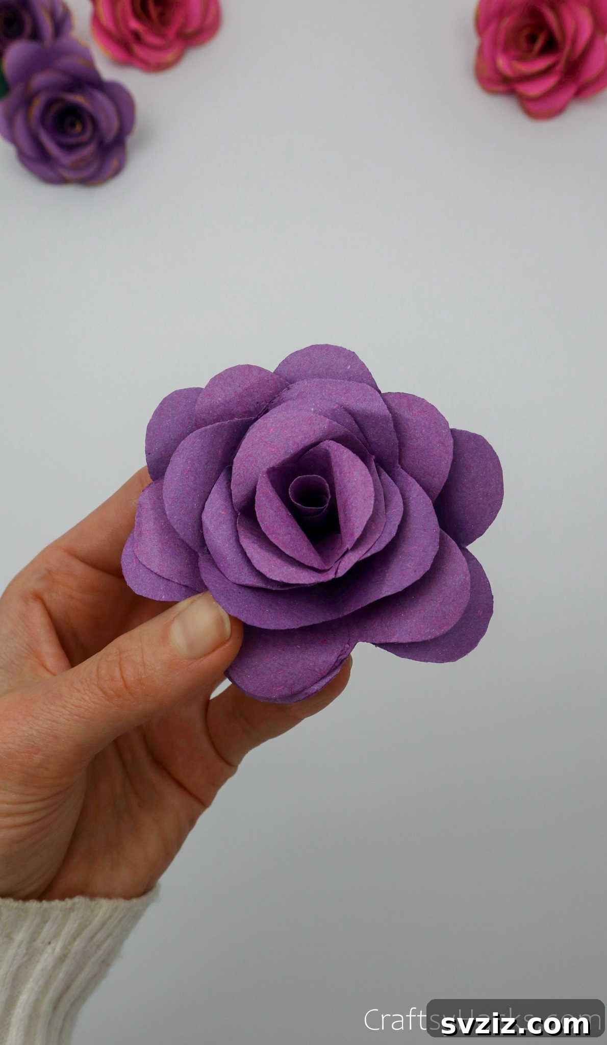 Crafting Beautiful Paper Blooms 28 A fully assembled purple paper flower, showcasing its beautiful layered structure