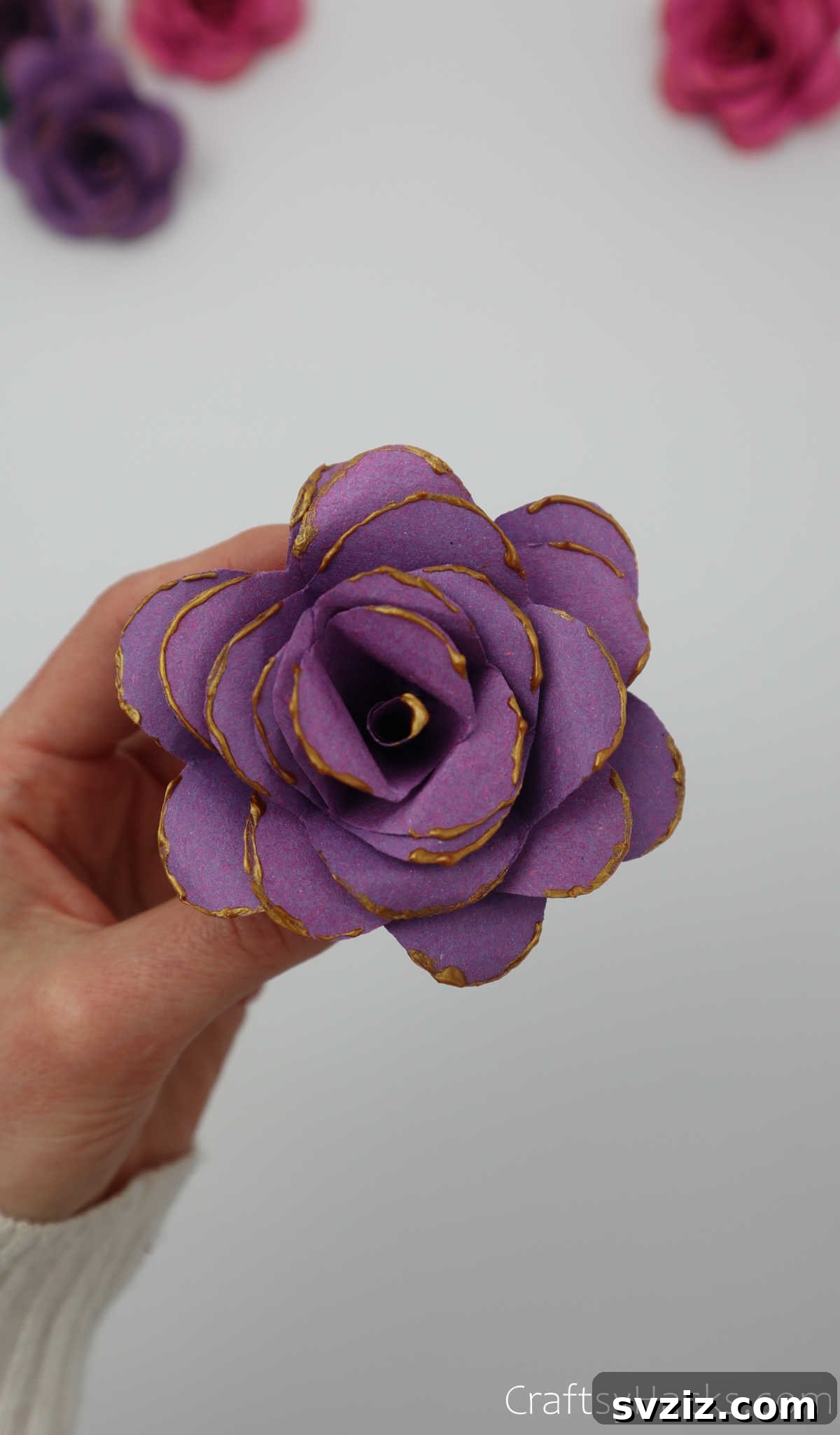 Crafting Beautiful Paper Blooms 30 A completed purple paper flower adorned with glitter, showcasing its elegant final appearance
