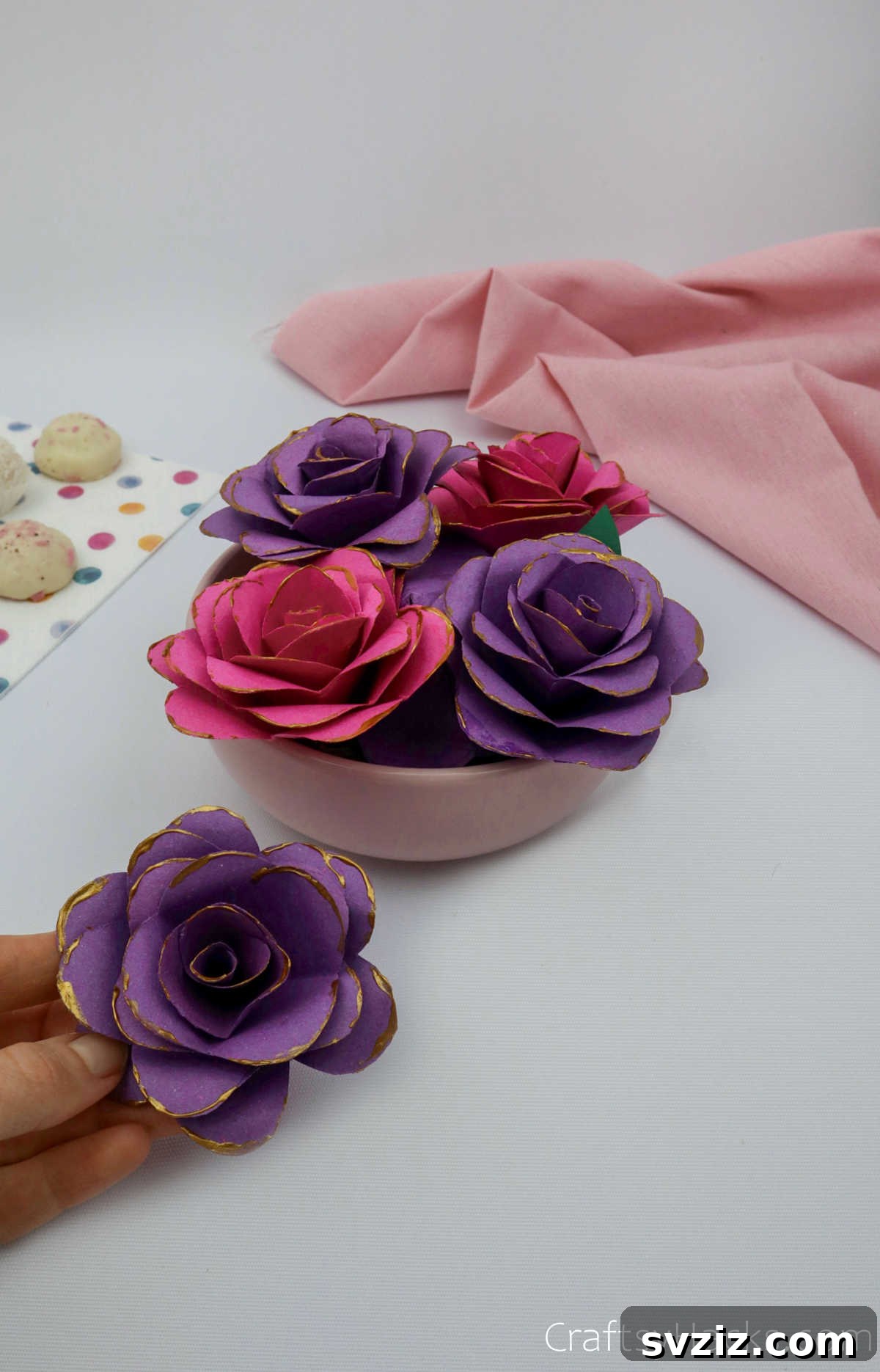 Crafting Beautiful Paper Blooms 4 A charming bowl filled with assorted handmade paper flowers in various shades of purple