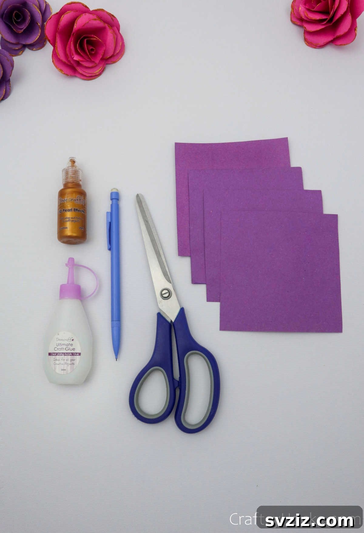 Crafting Beautiful Paper Blooms 5 Organized craft supplies including paper squares, scissors, pencil, and glitter glue