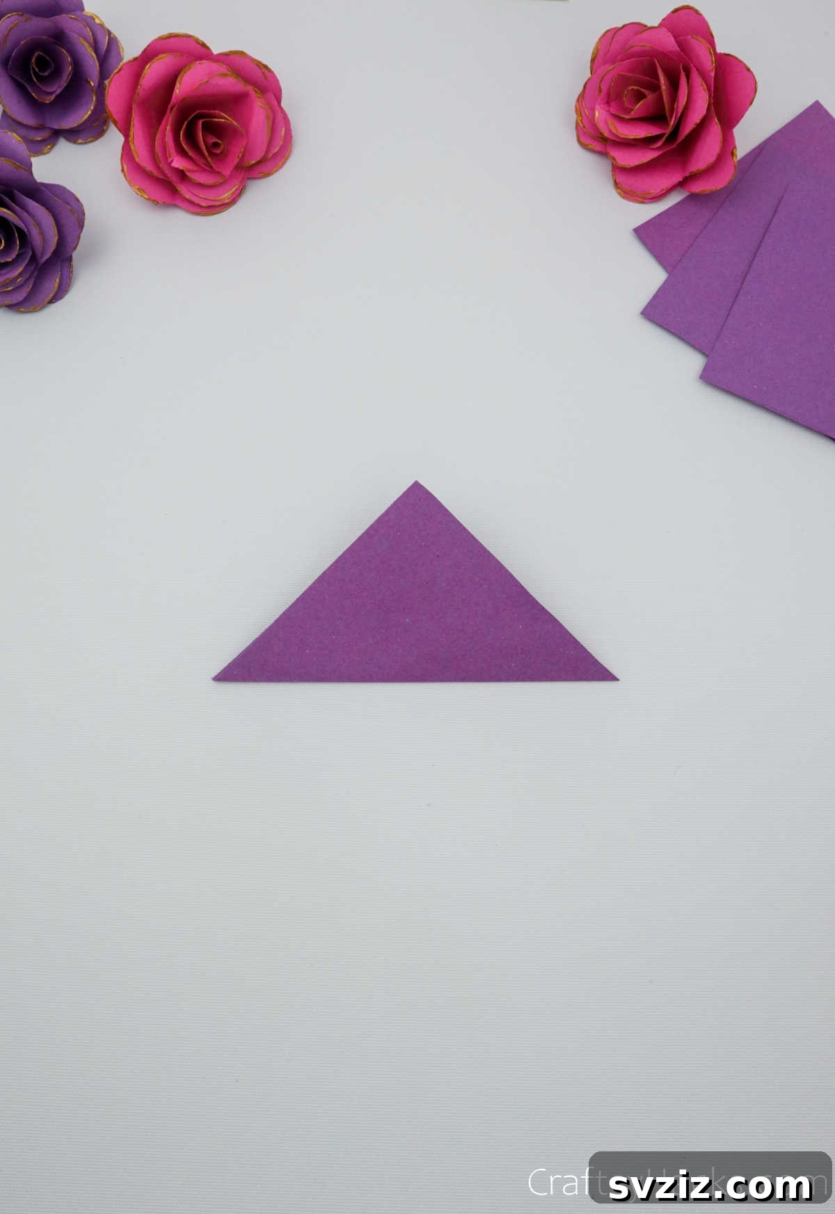Crafting Beautiful Paper Blooms 7 A perfectly creased purple paper triangle, ready for the next fold
