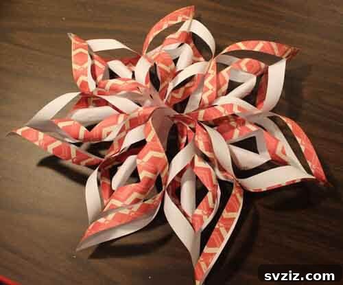 Kids making beautiful 3D paper snowflakes for festive decorations.
