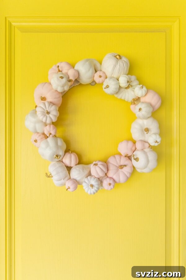27 Creative DIY Fall Wreath Designs 23 Charming Pumpkin Wreath overflowing with mini pumpkins