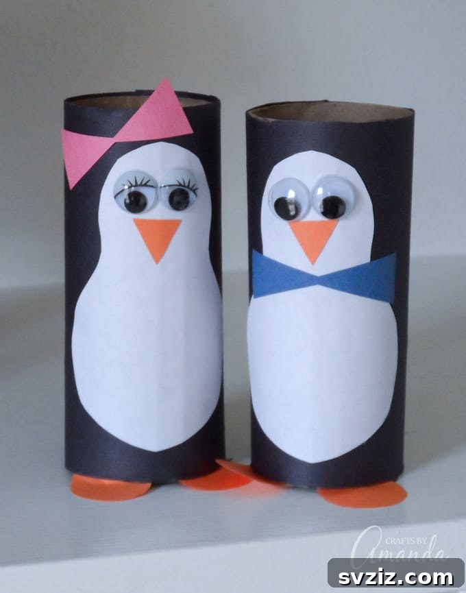 Crafted penguins made from cardboard tubes.