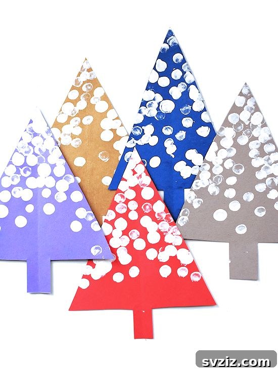 Kids' snowy fingerprint trees art project.
