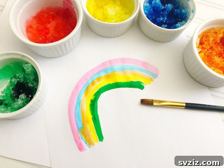 Kids painting with colored snow on paper.