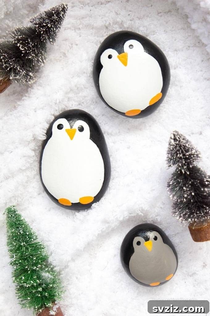Hand-painted penguin rocks for kids.