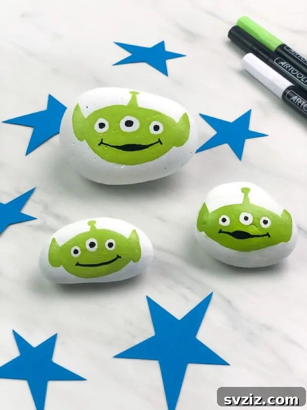 Tiny Treasures: 41 Adorable Rock Painting Ideas 17 Charming Toy Story Alien Rock Painting, inspired by the beloved movie.