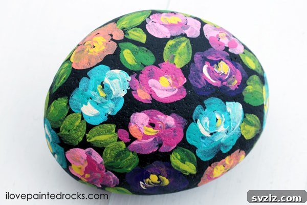Tiny Treasures: 41 Adorable Rock Painting Ideas 23 Spectacular Spring Floral Painted Rocks with bright, vibrant colors.